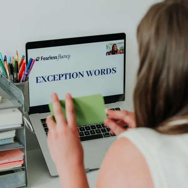 Person studying exception words for English Second Language tutoring.