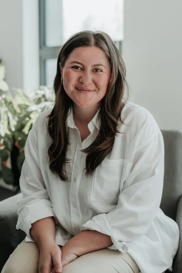 Woman working on laptop indoors.